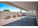 Charming backyard patio, featuring lush landscaping, shade, and decorative stone at 4529 Gracemont Ave, Las Vegas, NV 89139
