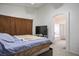 Cozy bedroom featuring neutral walls, tv and ensuite bathroom with shower and bathtub at 4529 Gracemont Ave, Las Vegas, NV 89139