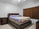 Spacious bedroom featuring a large bed, neutral walls, and a side table at 4529 Gracemont Ave, Las Vegas, NV 89139