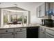 Eat-in kitchen boasts a dining area with backyard views, light-colored cabinets, and modern countertops at 4529 Gracemont Ave, Las Vegas, NV 89139