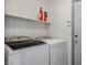 Laundry room features a side-by-side washer and dryer, with overhead storage at 4529 Gracemont Ave, Las Vegas, NV 89139