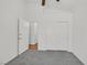 Bedroom featuring neutral carpet, double door entry, and a closet, providing functional space at 4624 Windy Hollow St, Las Vegas, NV 89130