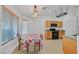 Bright dining nook with oak cabinets, tile floors, and backyard views at 4624 Windy Hollow St, Las Vegas, NV 89130