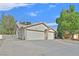 Features a three-car garage and a spacious driveway at 4624 Windy Hollow St, Las Vegas, NV 89130