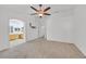 Spacious main bedroom with ceiling fan offering ample closet space and ensuite bathroom at 4624 Windy Hollow St, Las Vegas, NV 89130