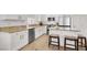 Well-equipped kitchen with stainless steel appliances, breakfast bar and granite countertops at 4937 Graziano Ave, Las Vegas, NV 89141