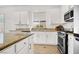 Bright kitchen featuring granite countertops and stainless steel appliances at 4937 Graziano Ave, Las Vegas, NV 89141