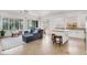 Open-concept living area with lots of natural light and access to backyard at 4937 Graziano Ave, Las Vegas, NV 89141