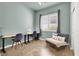 Well-lit office featuring two desks, comfortable seating, and a neutral color scheme at 4937 Graziano Ave, Las Vegas, NV 89141
