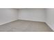 Neutrally decorated bedroom with plush carpeting, base trim and white walls at 5151 Tennis Ct, Las Vegas, NV 89120