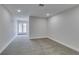 Large bedroom featuring neutral carpet, great light and a view to french doors to the outside at 5151 Tennis Ct, Las Vegas, NV 89120