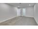 Bedroom with neutral carpet and light colored walls, plus a view to two separate closets at 5151 Tennis Ct, Las Vegas, NV 89120