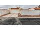 Exterior of a single-story home with a tile roof, a two-car garage, and desert landscaping at 5151 Tennis Ct, Las Vegas, NV 89120