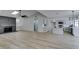Bright living space showcasing an open floor plan with modern fireplace, and a kitchen with an island at 5151 Tennis Ct, Las Vegas, NV 89120