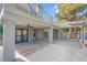 View of the covered back patio, featuring ceiling fans and a pergola, perfect for outdoor entertaining at 5264 Silverheart Ave, Las Vegas, NV 89142