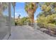 Spacious balcony area with gray railing and lots of natural sunlight surrounded by mature landscaping at 5264 Silverheart Ave, Las Vegas, NV 89142