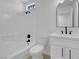Bright bathroom featuring a tiled shower-tub combination, vanity, and fixtures at 5264 Silverheart Ave, Las Vegas, NV 89142