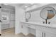 Modern bathroom featuring dual vanities with sleek black fixtures and ample counter space at 5264 Silverheart Ave, Las Vegas, NV 89142