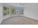 Spacious bedroom featuring large windows with serene views and a modern ceiling fan at 5264 Silverheart Ave, Las Vegas, NV 89142