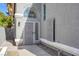 Inviting entrance with a stylish front door and unique window accents at 5264 Silverheart Ave, Las Vegas, NV 89142