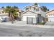 Two-story home featuring a gated front yard and a two-car garage at 5264 Silverheart Ave, Las Vegas, NV 89142