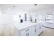 This kitchen has a large island with white countertops and plenty of storage space at 5264 Silverheart Ave, Las Vegas, NV 89142
