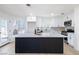 Modern kitchen featuring a large center island, white cabinets, and stainless steel appliances at 5264 Silverheart Ave, Las Vegas, NV 89142