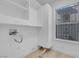 Bright laundry room with storage cabinets and white trim at 5264 Silverheart Ave, Las Vegas, NV 89142