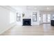 Spacious living room with fireplace and hardwood flooring, bathed in natural light at 5264 Silverheart Ave, Las Vegas, NV 89142