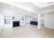 Bright living room with fireplace, wood floors, and neutral decor provides a calming and inviting space at 5264 Silverheart Ave, Las Vegas, NV 89142