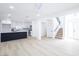 Bright and airy open-concept living space with white walls and hardwood floors at 5264 Silverheart Ave, Las Vegas, NV 89142
