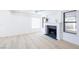 Cozy living room with a fireplace, hardwood floors, and modern decor at 5264 Silverheart Ave, Las Vegas, NV 89142