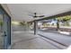 A covered patio features ceiling fans and stone columns that provide a cool and comfortable outdoor space at 5264 Silverheart Ave, Las Vegas, NV 89142