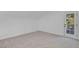 Well-lit room with plush carpeting and a door looking to a view of the yard at 5264 Silverheart Ave, Las Vegas, NV 89142