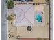 Top-down aerial view showcasing a private backyard with a geometric roof, pool, lounge area, and desert landscaping at 5801 Exbury Gardens Ct, Las Vegas, NV 89118