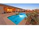 Exterior showing the backyard pool, spa and covered patio with fan at 5801 Exbury Gardens Ct, Las Vegas, NV 89118