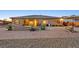 An exterior picture shows the backyard featuring an in-ground pool at 5801 Exbury Gardens Ct, Las Vegas, NV 89118