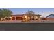 Beautiful single-story home with a well-manicured yard and a spacious three-car garage at 5801 Exbury Gardens Ct, Las Vegas, NV 89118