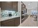Modern kitchen showcases stainless steel appliances, granite countertops, tiled backsplash, and ample cabinetry at 5801 Exbury Gardens Ct, Las Vegas, NV 89118