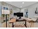 Bright and airy home office with a desk, chair, and butterfly wallpaper at 5801 Exbury Gardens Ct, Las Vegas, NV 89118
