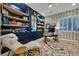 Charming office with custom built-ins, unique wallpaper, a comfortable chair, and a large window at 5801 Exbury Gardens Ct, Las Vegas, NV 89118