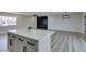 Open concept kitchen with island, white countertops, and stainless steel appliances at 6100 Fawn Cir, Las Vegas, NV 89107
