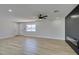 Bright living room showcasing flooring, lighting, and ceiling fan at 6100 Fawn Cir, Las Vegas, NV 89107