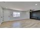 Bright living room showcasing modern fireplace, new flooring, and recessed lighting at 6100 Fawn Cir, Las Vegas, NV 89107