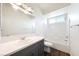 Well-lit bathroom featuring double sinks, ample counter space, and a shower at 6101 Cavalry Trl, Pahrump, NV 89060