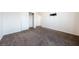 Comfortable carpeted bedroom featuring closet space and modern fixtures at 6101 Cavalry Trl, Pahrump, NV 89060
