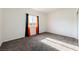 Bright bedroom with a window and modern gray carpet flooring at 6101 Cavalry Trl, Pahrump, NV 89060