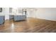 Open living area with hardwood floors extending to a modern kitchen, ideal for entertaining and Gathering gatherings at 6101 Cavalry Trl, Pahrump, NV 89060