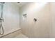 Modern tiled shower stall with a sleek shower head, built-in seat, and shower niche at 6101 Cavalry Trl, Pahrump, NV 89060