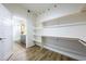 Large walk-in closet leading to the ensuite bath with custom shelving at 6101 Cavalry Trl, Pahrump, NV 89060